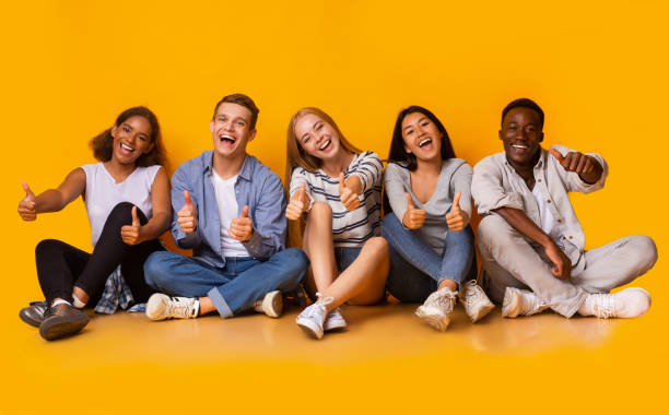 istock Positive group of international students showing thumbs up 2183282381
