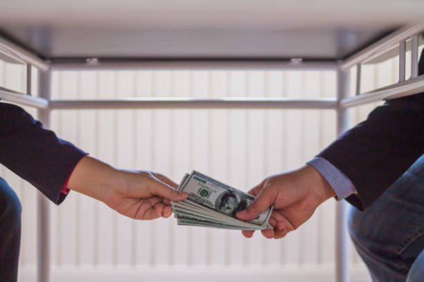 istock Blur image,corruption on officials in order to obtain items and projects that they want as an offense by giving money for corruption. idea of combating and preventing corruption by government official 2183282613