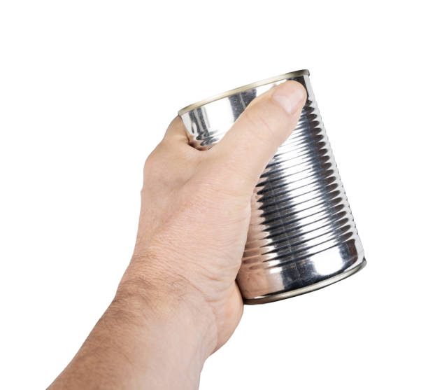 istock a metal food jar in the hand 2183283149
