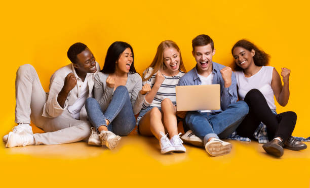 istock Group of classmates checking exam results online, using laptop 2183283723