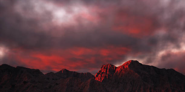 Dry rocky mountains in sunset light under a cloudy sky. 3D render.