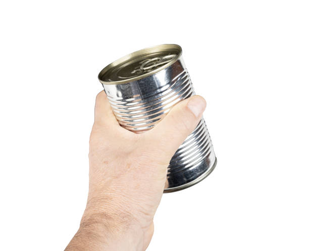istock a metal food jar in the hand 2183284675