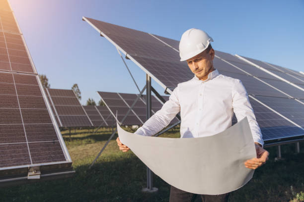 istock Engineer Inspecting Solar Panels at a Renewable Energy Site 2183285826