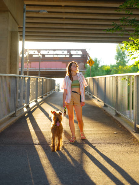 istock WOman walking with dog in suburbs in Canada 2183286956