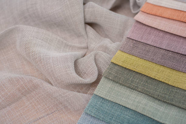 istock Multicolored fabrics for curtains. Linen fabric with textured weaving for interior decoration 2183288190