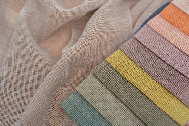 istock Multicolored fabrics for curtains. Linen fabric with textured weaving for interior decoration 2183288351
