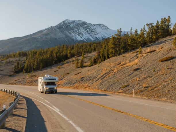 istock Camper van on road through Canadian Rockies 2183292396