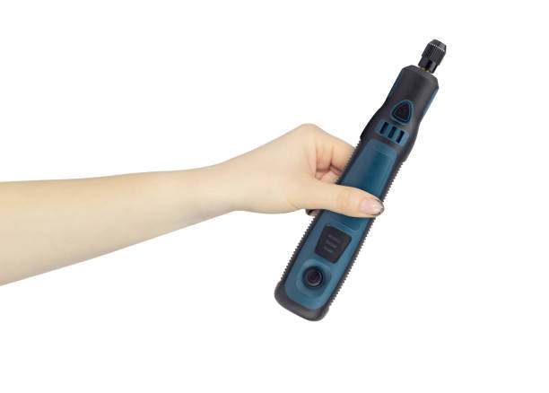 istock hand-held electric engraver on battery in hand, outstretched hand with hand-held electric engraver isolated from background 2183293215