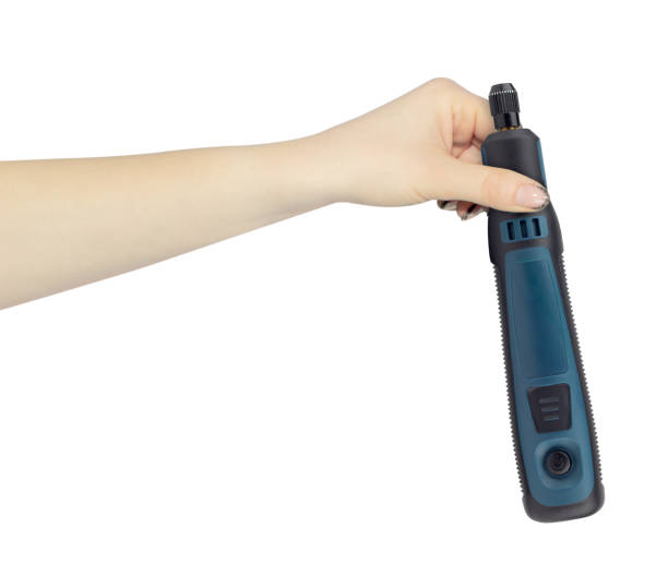 istock hand-held electric engraver on battery in hand, outstretched hand with hand-held electric engraver isolated from background 2183293239
