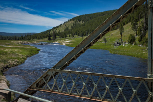 Old metal bridge over Madison River close to Biscuit Basin and black diamond pool and avoca spring geyser. In Yellowstone National Park.Close to Grand Loop Road. USA