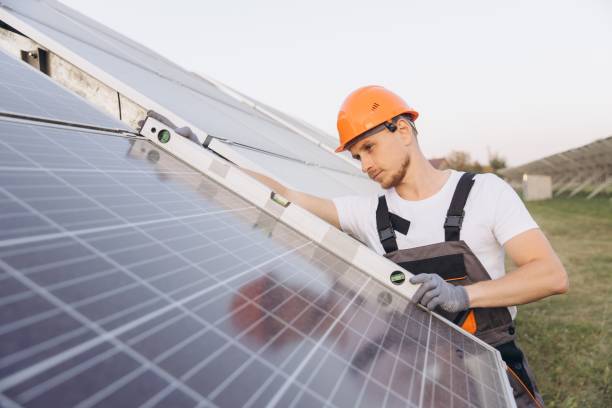 istock Engineer Inspecting Solar Panels at Outdoor Installation Site 2183295934