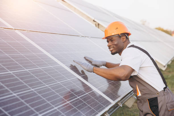 istock African American Male Smiling Technician Working on Solar Panel Installation Outdoors 2183295938