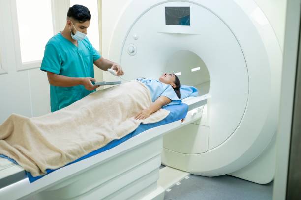 istock Nurse preparing patient for her MRI scan 2183296220