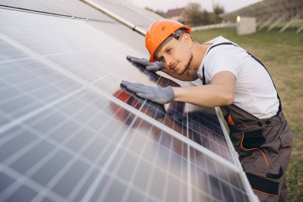 istock Technician Inspecting Solar Panels in Outdoor Solar Farm 2183298171