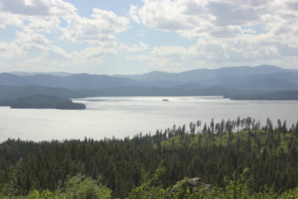 istock Panoramic View of Lake and Forested Hills 2183299013
