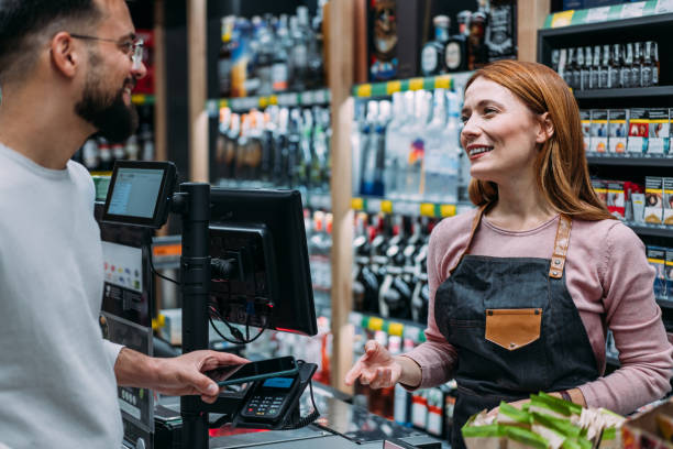 istock Man using phone to make the payment at the supermarket 2183299746