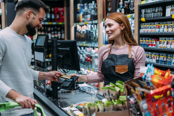 istock Man using phone to make the payment at the supermarket. 2183299757