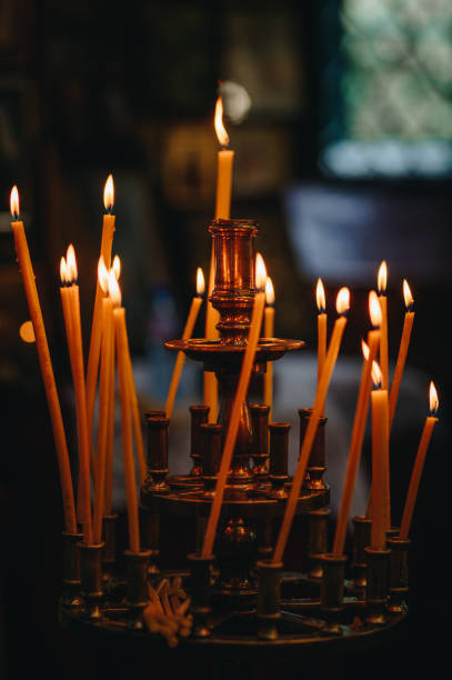istock Candles in a church 2183300892