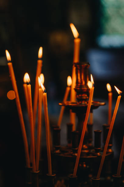 istock Candles in a church 2183300899