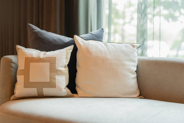 A modern designed sofa Pillows And Cushions On Sofa Stylish colorful cushions on couch in living room