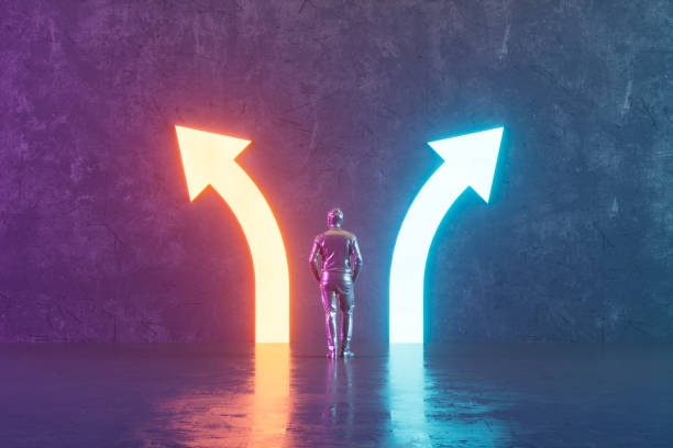 Choices concept with neon arrows in dark room stock photo