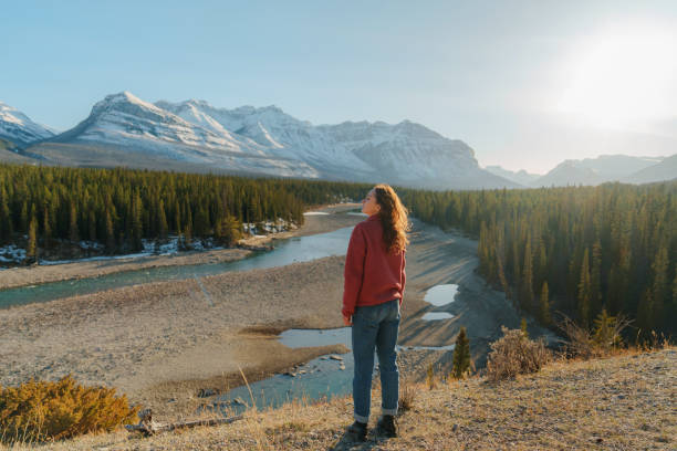 istock Woman looking at river in Canadian Rockies wilderness 2183304987