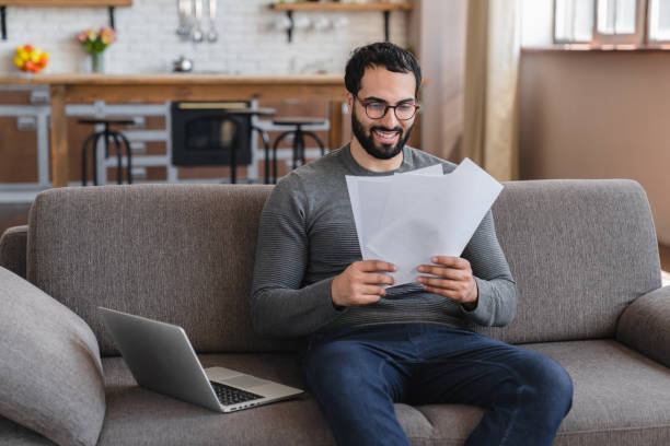 istock Excited Arabian man holding document, paper notification, job promotion, loan approval 2183306909
