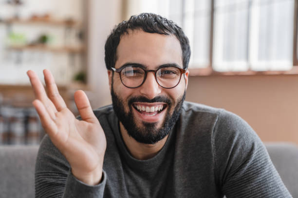 istock Cheerful Arabian freelancer business man talking on video conference call from home 2183306953