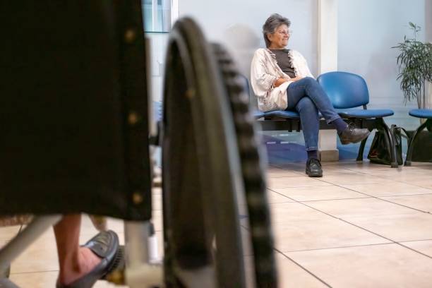 istock Older woman in the laboratory waiting room 2183306970