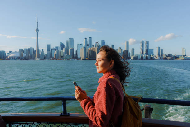 istock Woman using smartphone on the move in Toronto 2183307466