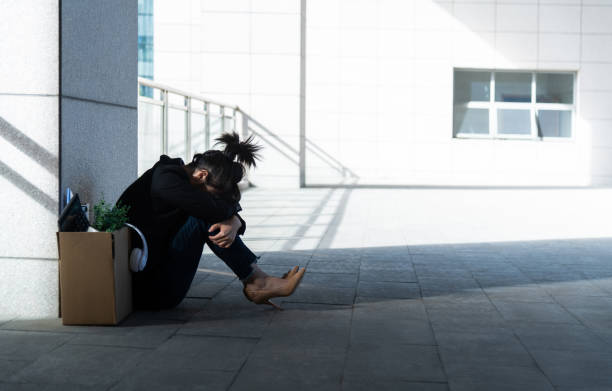 Unemployed man sitting outside the office building