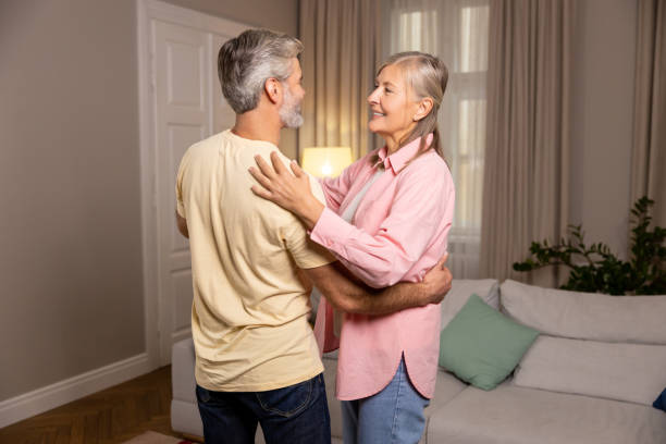 istock Happy mature couple dancing at home and feeling romantic 2183310251
