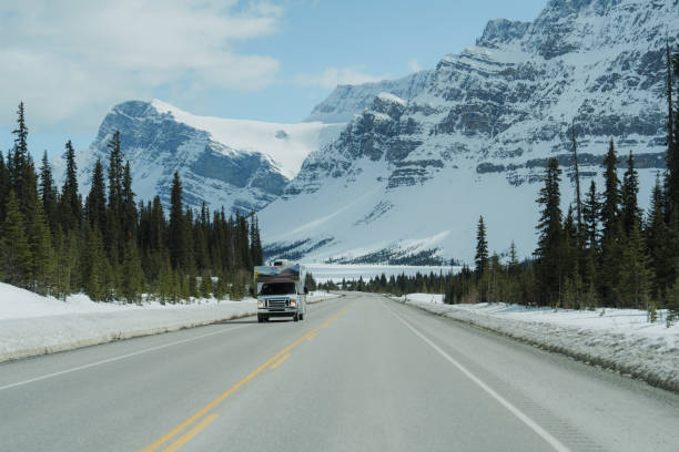 istock Truck on highway through  Canadian Rockies in spring 2183311341