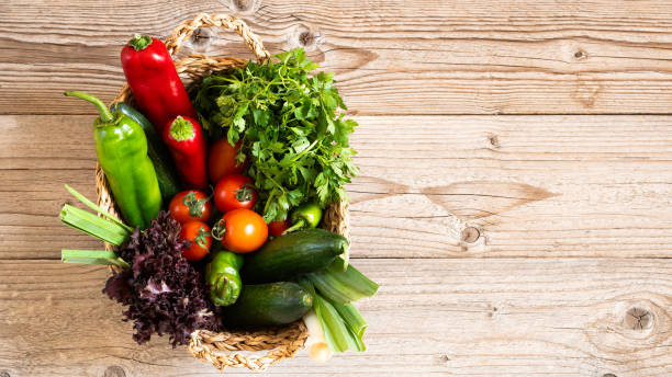 istock Vegetables in the basket organic vegetables on background 2183314162