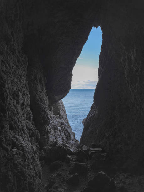 istock Narrow hole in the cave, an exit from the dungeon 2183315325