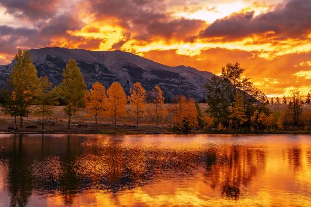 istock Quarry Lake Mountain Reflections Under A Golden Sky 2183315338