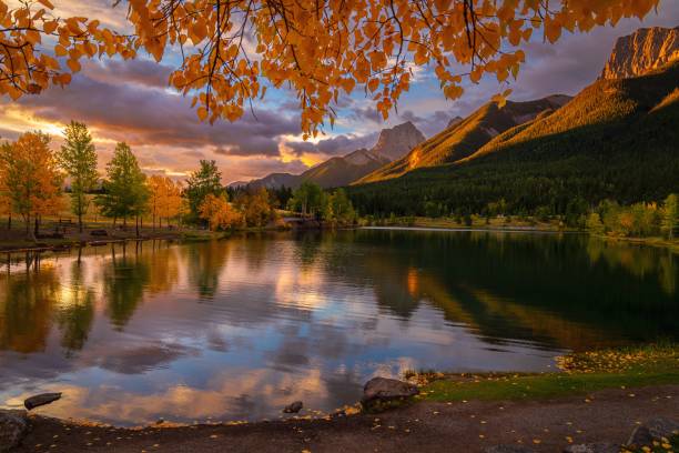 istock Autumn Foliage Framing Quarry Lake Mountains 2183315365