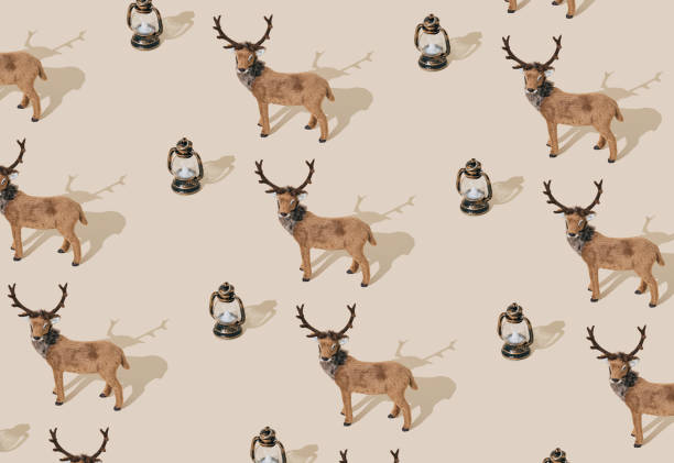 istock Trendy Christmas pattern made with brown reindeer and vintage lantern on pastel cream background. Minimal creative Christmas and New Year concept. Festive holiday pattern backdrop. Xmas aesthetic. 2183318656