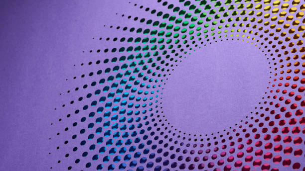 istock Vibrant Circular Cut-Paper Artwork with Gradient Dots Creating Spiral Effect on Purple Background 2183318796