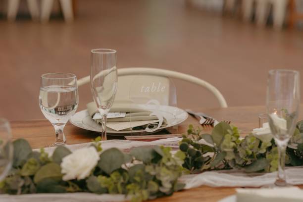 istock Elegant wedding table setting with flowers and glasses, perfect for a romantic celebration 2183320101