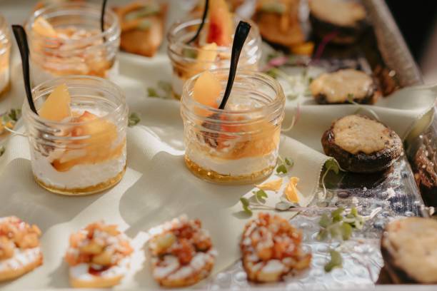 istock Festive table with a white tablecloth adorned with desserts for a celebration 2183320122