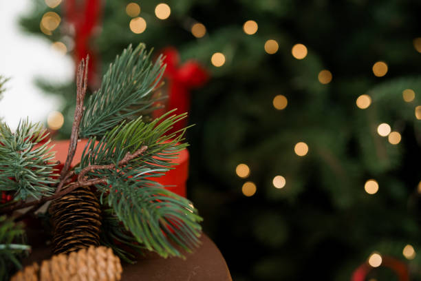 Festive Holiday Decor with Pine Branches and Soft Bokeh Lights