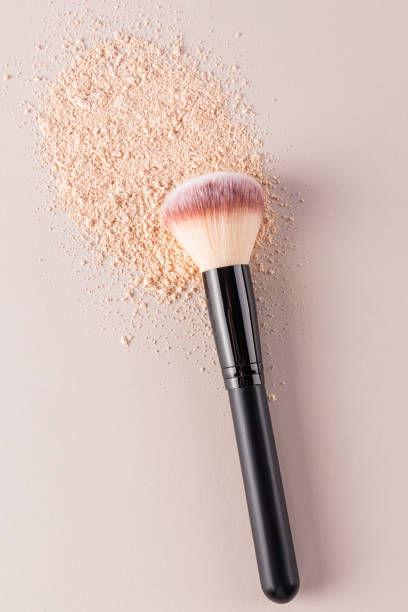 istock Chic professional makeup brush dry cosmetic textures on beige background, vertical top look. close up. . Care and beauty concept 2183322710