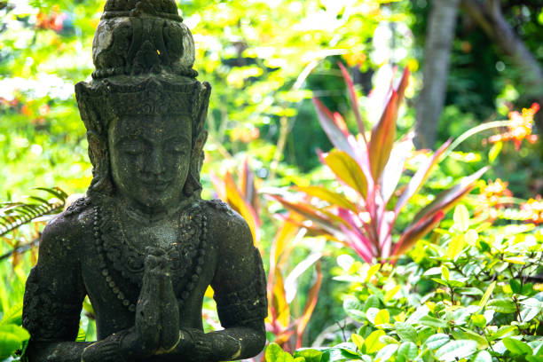 istock Balinese statue in a garden 2183323135