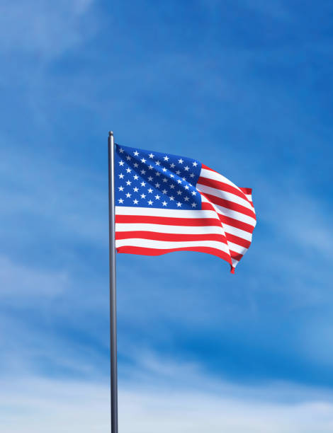 istock American flag waving in blue sky. 2183324798