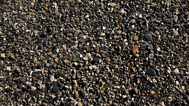 istock Pebbles on the beach as an abstract background. Texture. 2183325535