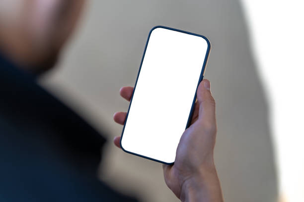 istock Close-up of white screen phone in unknown man's hand 2183326784