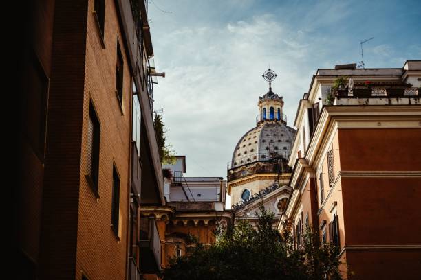 istock Historic dome framed by buildings in Rome 2183327226