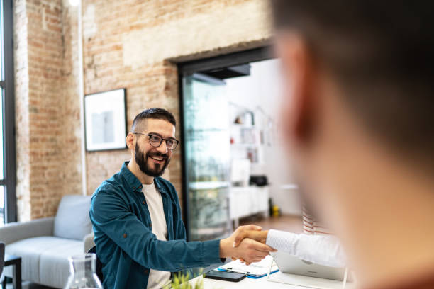 istock Business persons shaking hands on a meeting. 2183327537