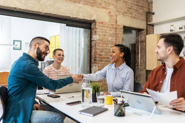 istock Business persons shaking hands on a meeting. 2183327574